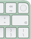 Magic Keyboard, pravý horní roh, zelená barva, Touch ID, klávesa Delete a funkční klávesy na ovládání hlasitosti