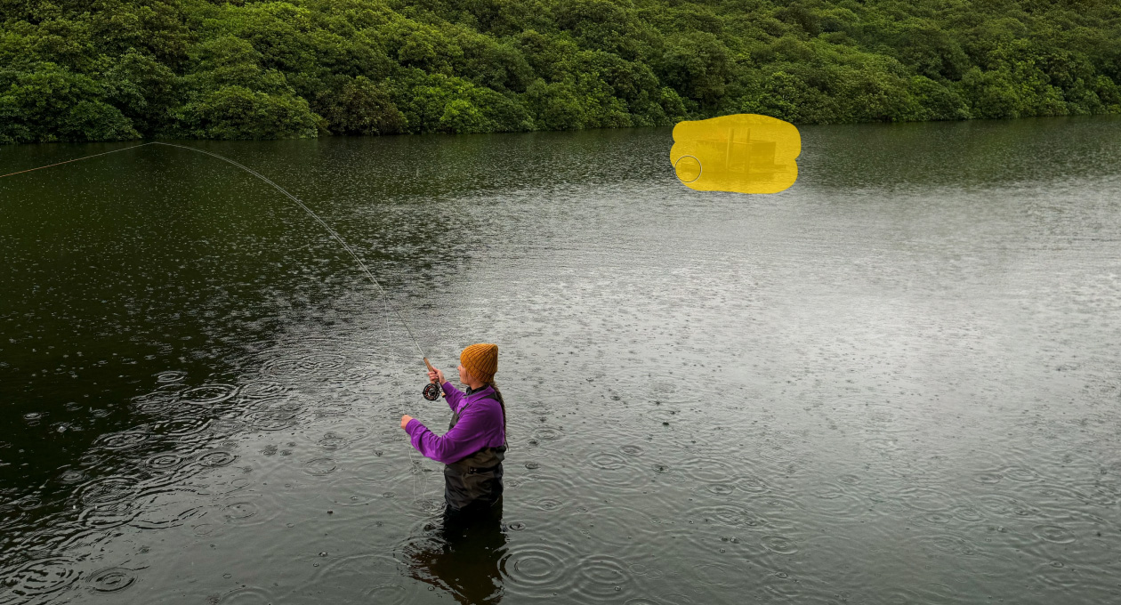 Photo of a woman fly-fishing in a lake, Pixelmator Pro tool removing unwanted object in the background being highlighted in yellow